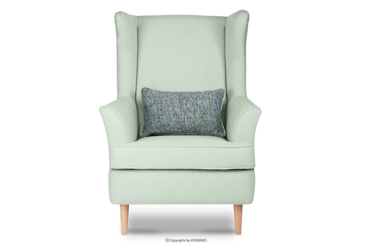Skandinavischer Sessel grün auf Beinen